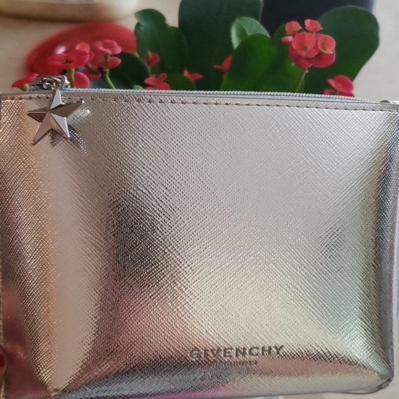 Givenchy Handbags - Givenchy small silver make up pouch